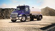 Peterbilt Model 537 Medium Duty Purple Truck with Aluminum Water Tank Body in Quarry - Thumbnail